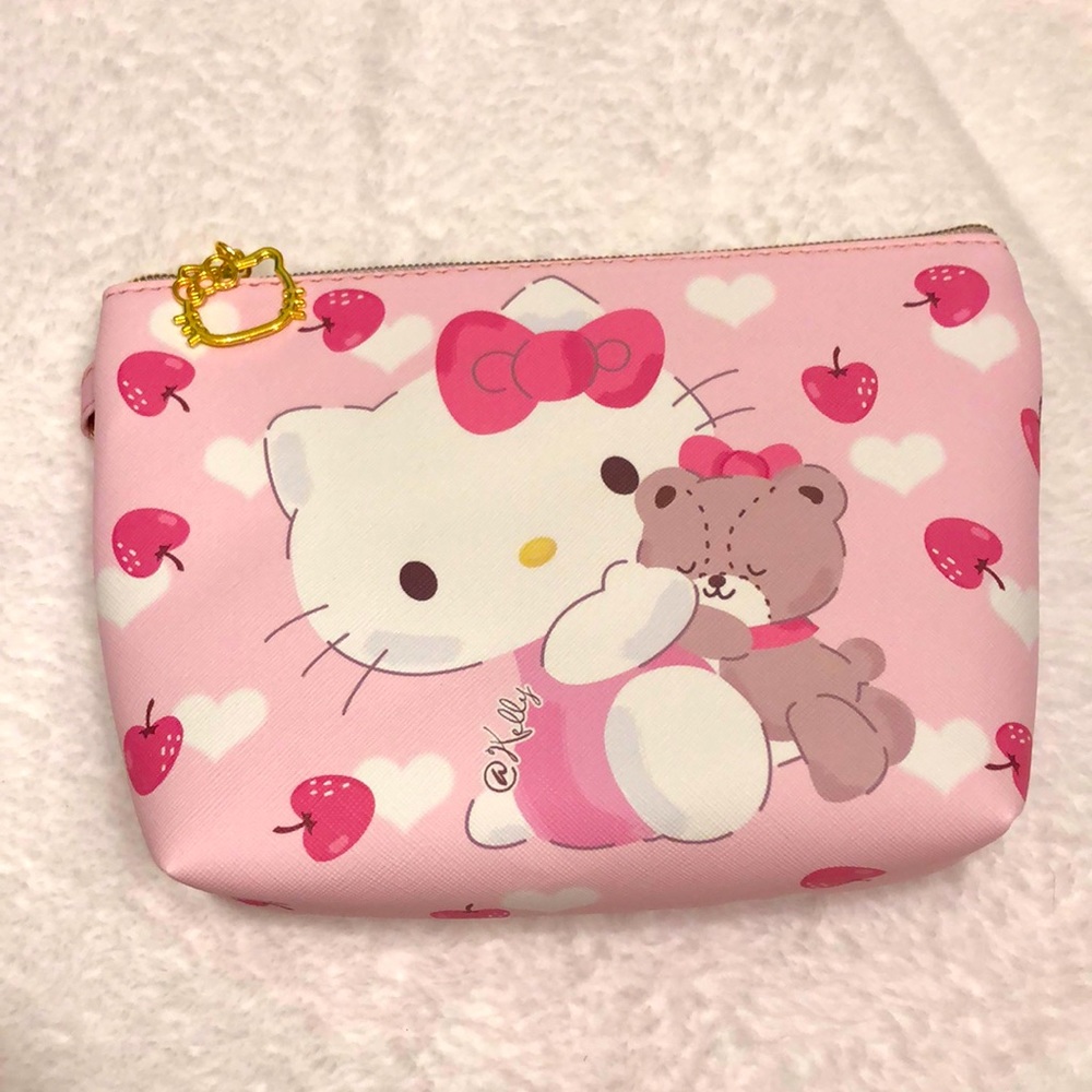 Hello Kitty wristlet handbag with apples and hugging a bear! Exquisite quality!